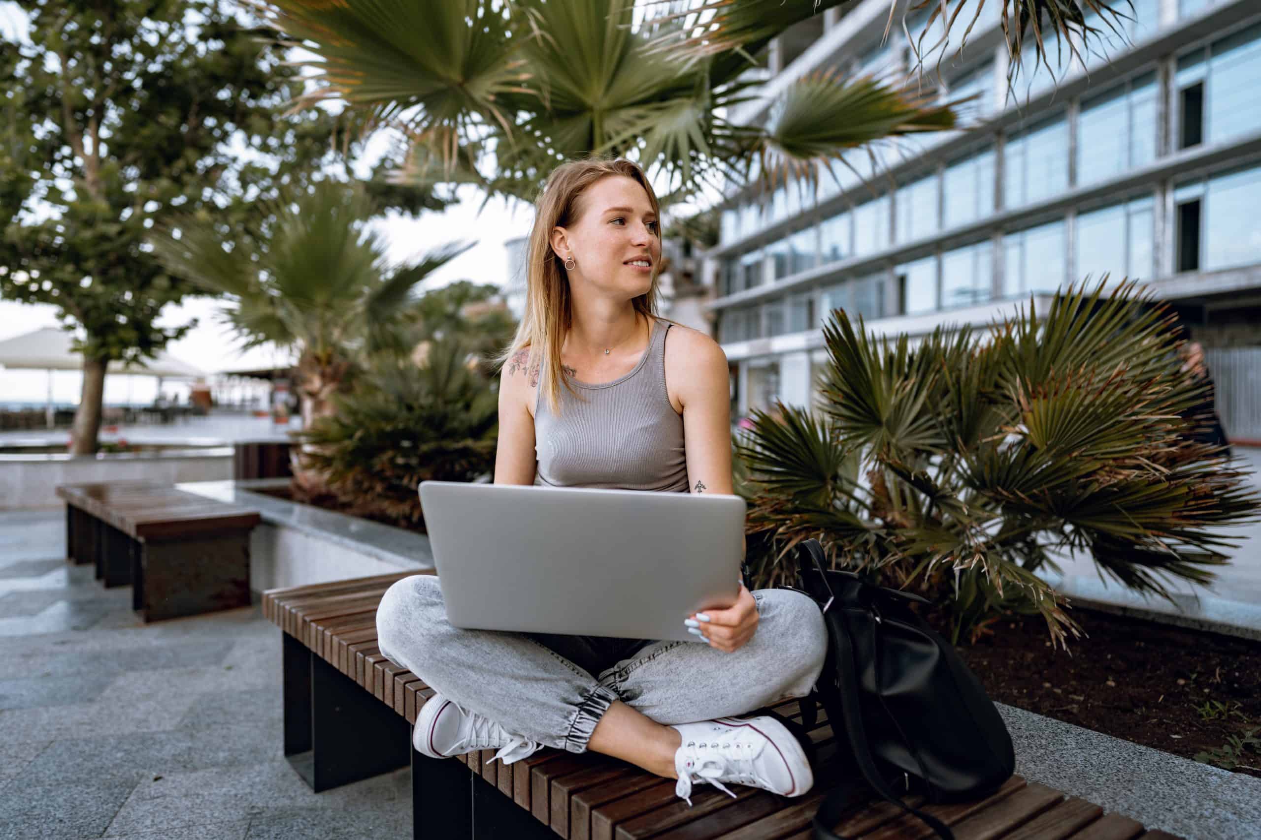 Young woman searching for a job on her laptop